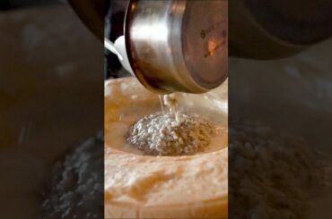 Amazing Italian food - Cooking Risotto on huge parmigiano reggiano cheese