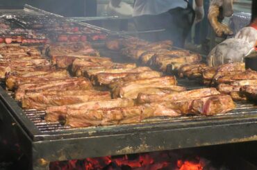 Italy Street Food Event. Ribs, Sausages, Melted Cheese with Ham, Huge Filled Burgers, Skewers