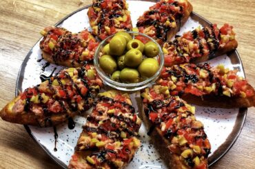 Italian bruschetta snacks with tuna, olives and tomatoes. Easy party appetizers | CookAtHome