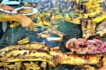 Street Food in Italy. Roasted Piglets, Ribs, Grilled Sausages, Superloaded Sandwiches