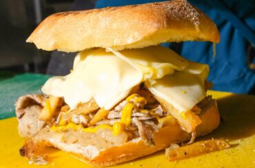 Italian Big Sandwich with Porchetta, Melted Cheese, Fries and Sauces. London Street Food