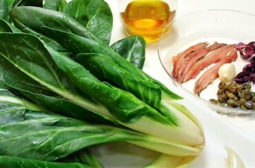 Swiss Chard Ribs in a pan with black olives, capers - italian style