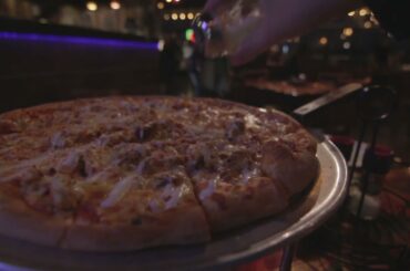 Seasoning Pizza at Italian Restaurant