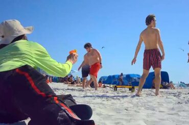 SQUIRTING PEOPLE ON THE BEACH