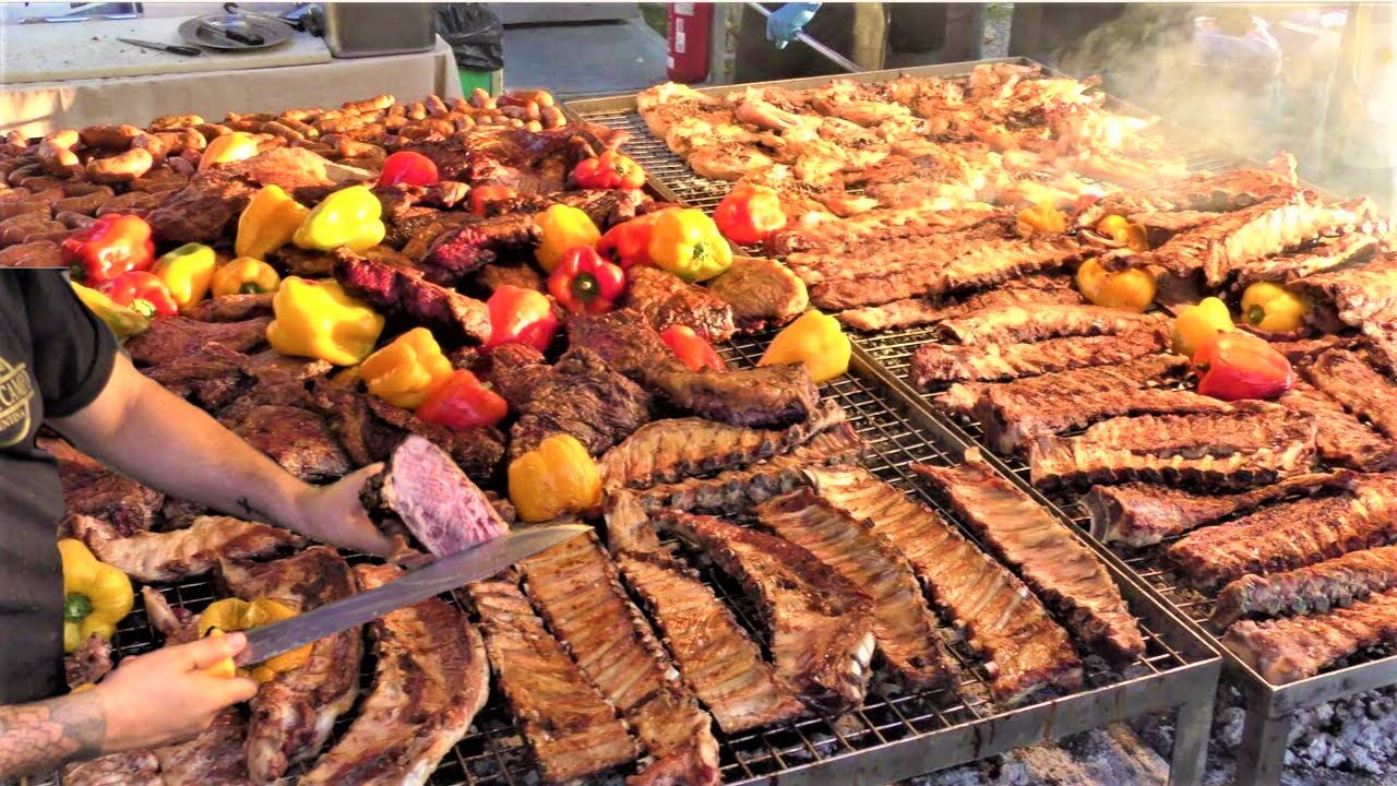 Street Food in Italy. Grilled Meat from Argentina, Asado, Sausages, Ribs, Pork Legs, Veal Steaks Street Food in Italy. Grilled Meat from Argentina, Asado, Sausages, Ribs, Pork Legs, Veal Steaks