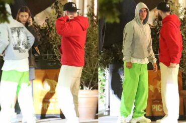 Justin Bieber wears his tour hoodie while dining with his wife Hailey.