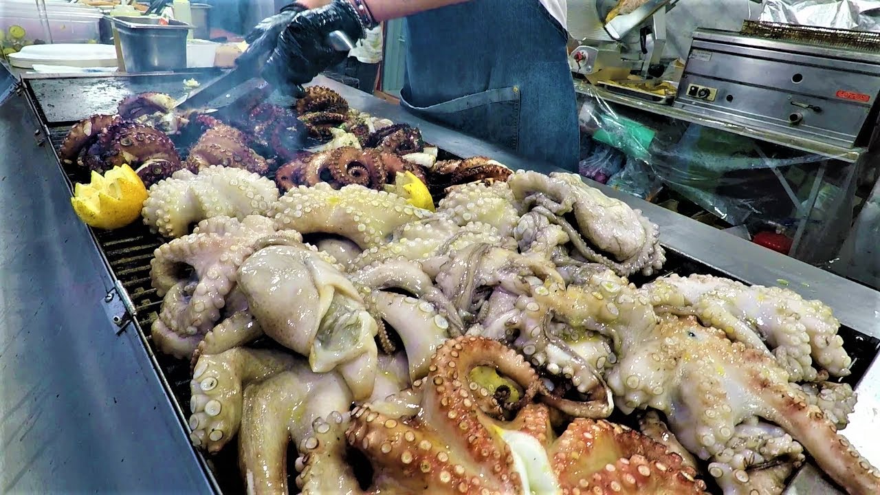Italy Street Food. Massive Dose of Giant Grilled Octopus and 'Puccia' with Creamy 'Burrata' Cheese Italy Street Food. Massive Dose of Giant Grilled Octopus and 'Puccia' with Creamy 'Burrata' Cheese