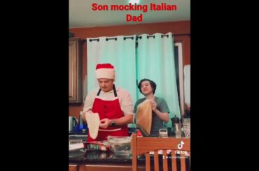 Son mocking Italian Dad with pizza making.