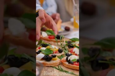 Person Picking up Food Starter from a Dining Table#short