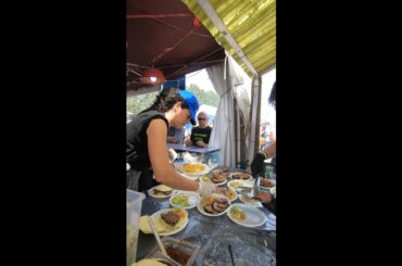 Cutting Ribs and Grilled Meat. Argentina Street Food. Biker Fest 2022. Lignano, Italy