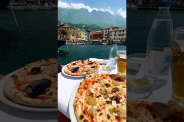 Pizza with a view. @brigrc shows us the most perfect dining setup in Lake Garda, Italy. #shorts