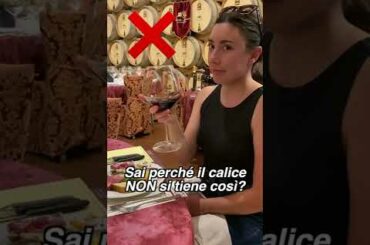 how to properly hold a glass of wine (and why)