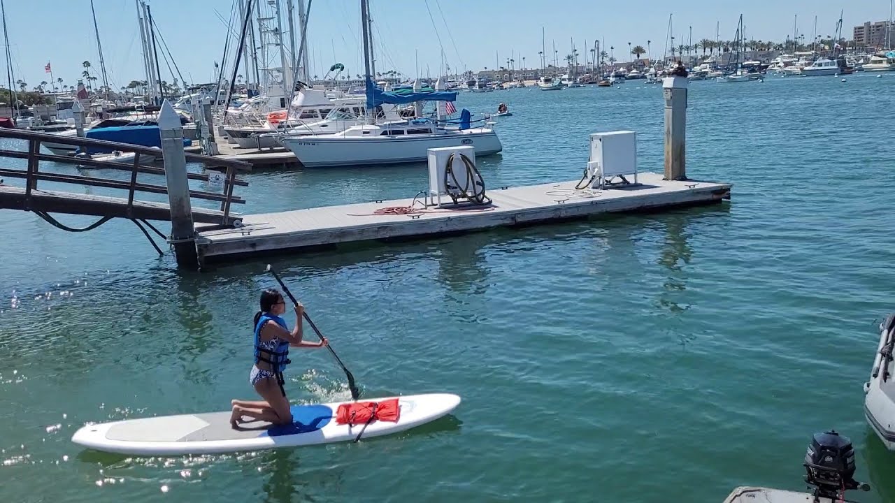 Stand up paddle boarding at the Grand Canal in Balboa Island Newport Beach California USA Stand up paddle boarding at the Grand Canal in Balboa Island Newport Beach California USA