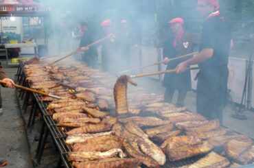 Italy street Food. Raclette Melted Cheese, Huge Grill of Juicy Ribs and more Food from Europe