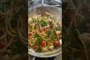 Spaghetti with mussels and mullet bottarga, italian pasta.