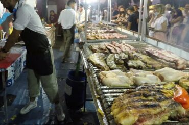 Italy Street Food Festival in Milano. Grilled Meat, Roasted Pork, Sausages, Burrata, Fried Pizza