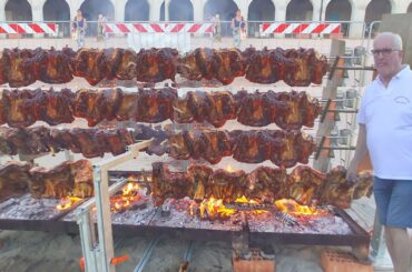 Huge Automatic Machinery Roast Tons of Pork Ribs. Italy Street Food Event