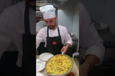 Cooking a big pan of Italian maccheroni Pasta. Food of Turin, Torino, Italy