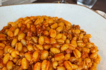 Malloreddus alla Campidanese, these Sardinian gnocchi are cooked with a delicious fennel sausage, saffron and tomato sauce. So yummy!! (Yes I ate the whole thing!)