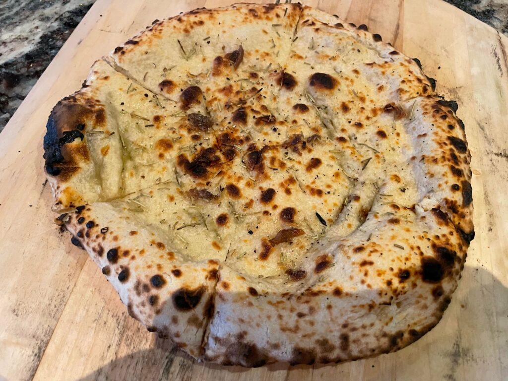 Focaccia Napolitain herbs and bits of anchovy. Dough: Sourdough 00 62% 48h 61F. Oven temp 850F