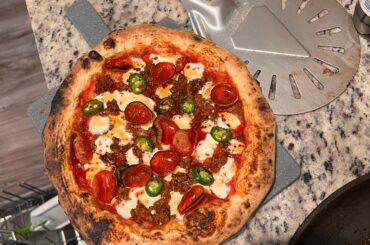 Hot sausage, pepperoni, grilled onions, Serrano peppers, hot honey. I call it the “burning down the house” pizza.