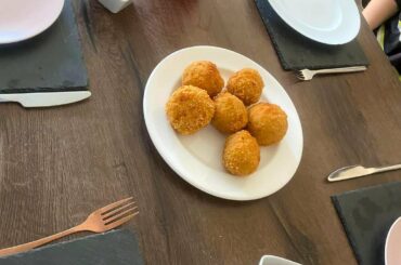 Arancini and tagliatelle arribiata. I'm not Italian but I'm trying my best!