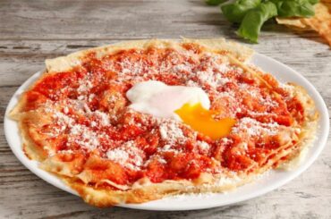 The classic Pane Frattau recipe is made using Sardinia’s most famous bread – pane carasau. Topped with simple tomato sauce, a poached egg and some grated pecorino cheese, it is a perfect example of Sardinian cuisine.