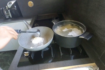 Spaghetti with ricorda, lemon, fresh tomatoes on a cold Mint pesto