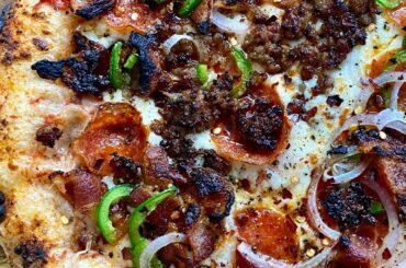 Italian sausage, pepperoni, jalapeños, red onions, and bacon