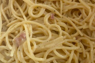 spaghetti alla carbonara: spaghetti, egg yolks, pecorino romano, black pepper, bacon.