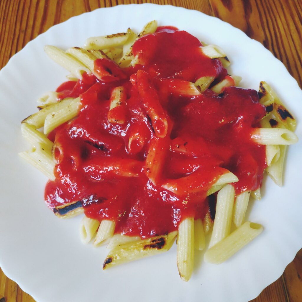 Burnt pasta with strawberry sauce