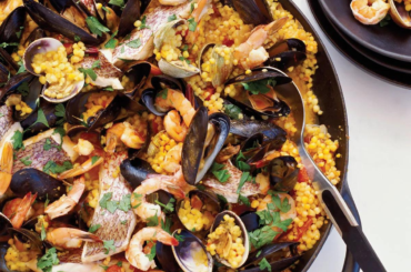 Seafood Fregola with saffron. Fregola, which means breadcrumbs, is a typical Sardinian pasta made of semolina rolled into small balls. There are plenty of recipes for cooking fregola but the most delicious is definitely a seafood fregola: with clams, prawns and served with some saffron broth.