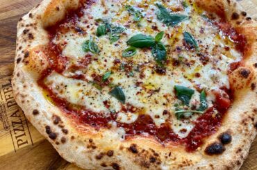 Pizza Margherita with a little cracked pepper and red pepper. 72 hour Poolish dough.