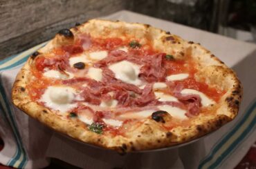 Pizza with salami and cooked ham