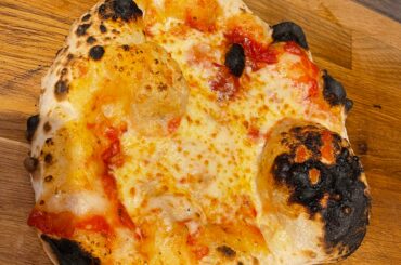 A tad much cheese. 67.5% water. 450c, cooker in a roccbox. Tasted amazing. The puffy bits of crust are superb