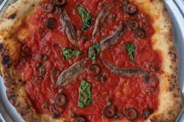 Pizza Puttanesca (San Marzano tomatoes, anchovies, capers, black olives)