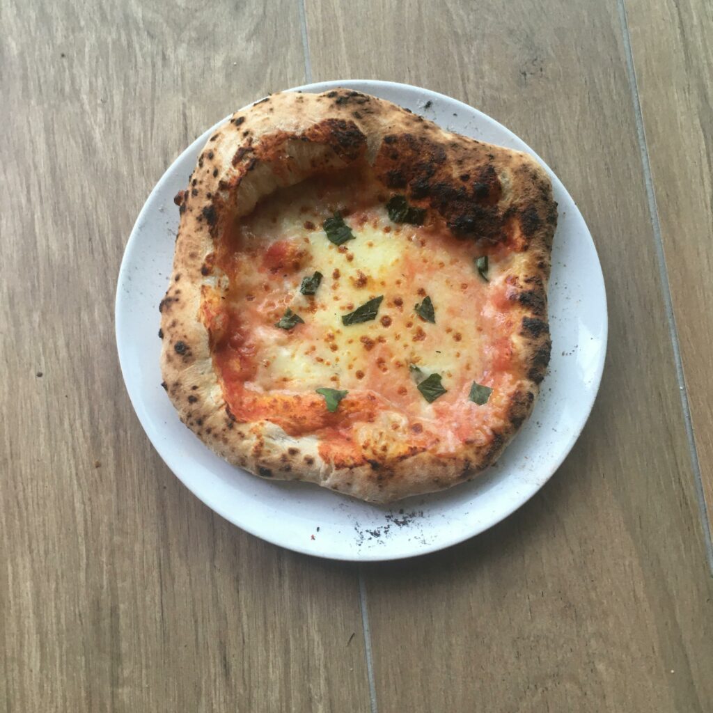 Progress! This is my latest pizza, it tasted very good and looks quite a bit better than my last post!!