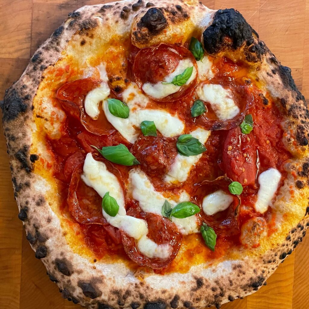 Lightly sauced then topped with whole Bianco DiNapoli tomatoes