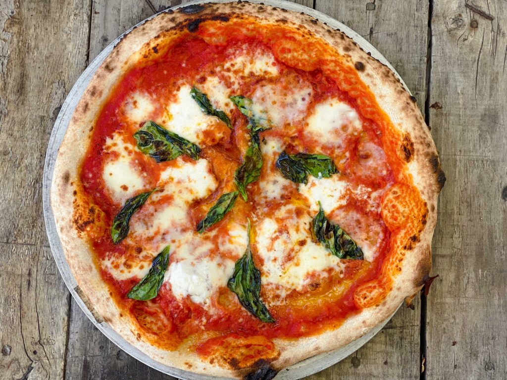 Here's a sourdough Pizza Margarita I made in my WFO this past week. 50/50 BF & 00, 60% hydration, 48 hr cold rise.