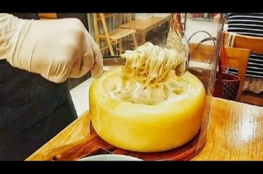 Satisfying fresh pasta making and serving in a cheese wheel!