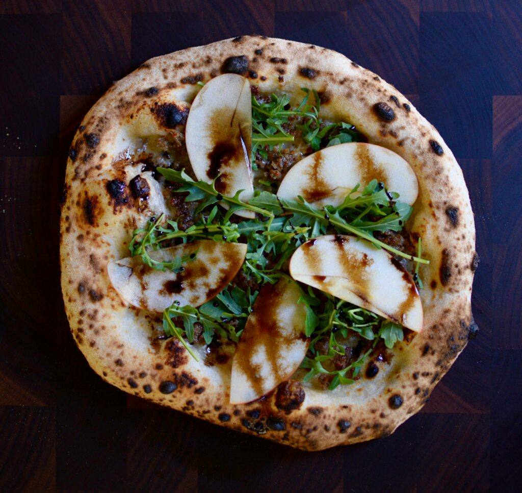 Parmesan cream base, fennel sausage, arugula, honey crisp apple, balsamic drizzle. One of my new favorites after this weekend.