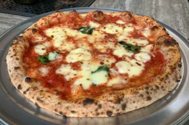 Practicing making pizza at home.