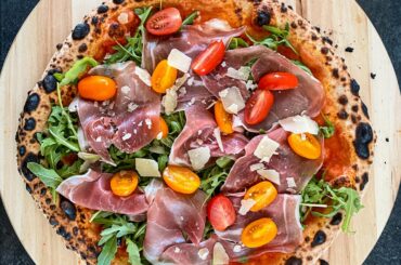 Arugula / Prosciutto crudo / tomatoes / parmesan