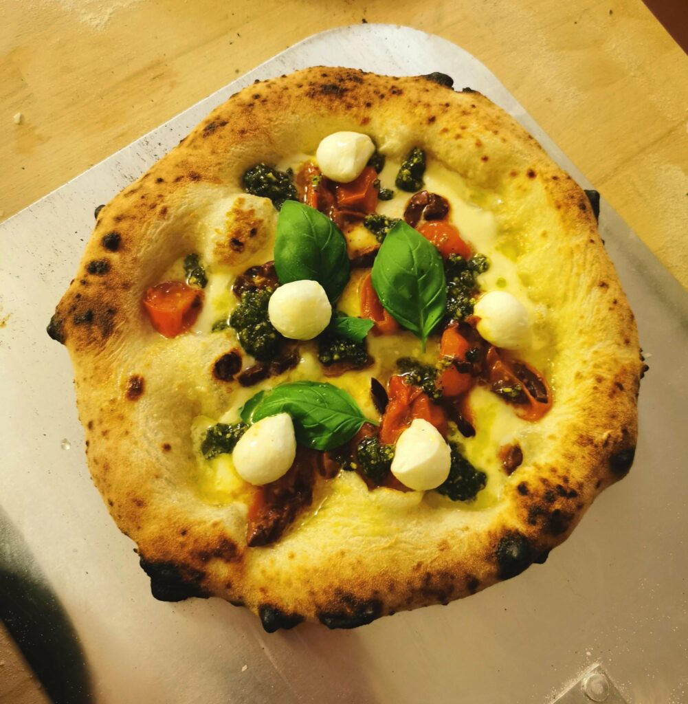 Bianco with Mozarella&Parmegiano, Pistachio Pesto, sautéed tomatoes&olives, Mozarella Balls