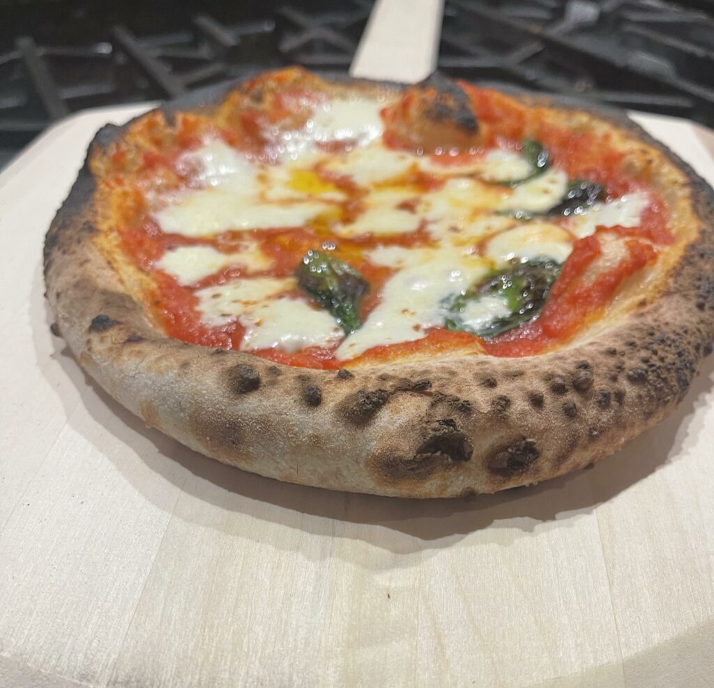 First pizza ever, burnt the hell out of back half but still tasted good.