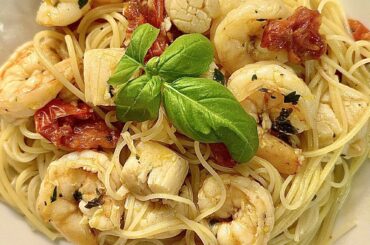 Shrimp and scallops aglio e olio con pomodorini over angel hair. That’s a mouthful. 😉 Recipe in comments.