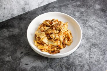Ragú of wine braised pork shoulder, soffritto sautéed in lard, roasted red pepper & garlic confit - Served with fresh pappardelle