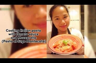 Cooking Italian Pasta with tomato sauce and Mozzarella (Pasta al sugo mantecata)