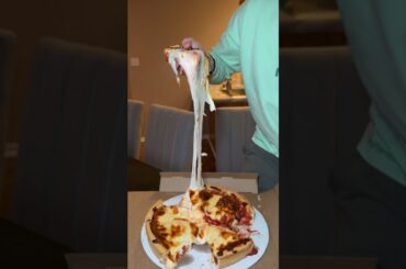 Eating Little Joe’s Pizza and doing a cheese pull test!