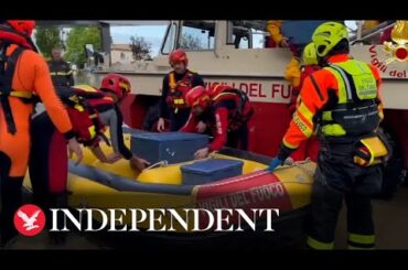 Italy floods: Firefighters deliver food to patients as hospital surrounded by water